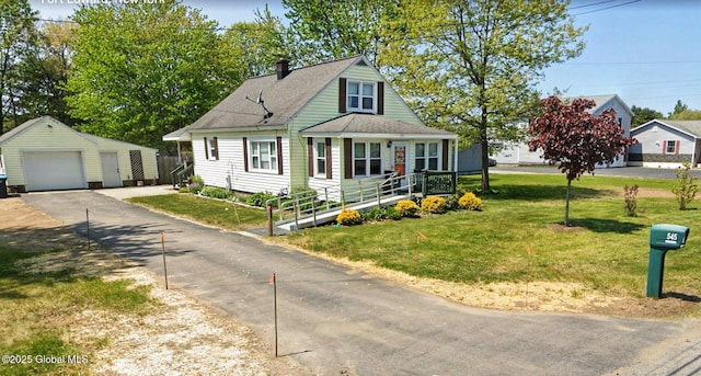 545 Gansevoort Rd, South Glens Falls, NY 12803 - view of front of house with an outdoor structure, a garage, a chimney, a front lawn, and a shingled roof