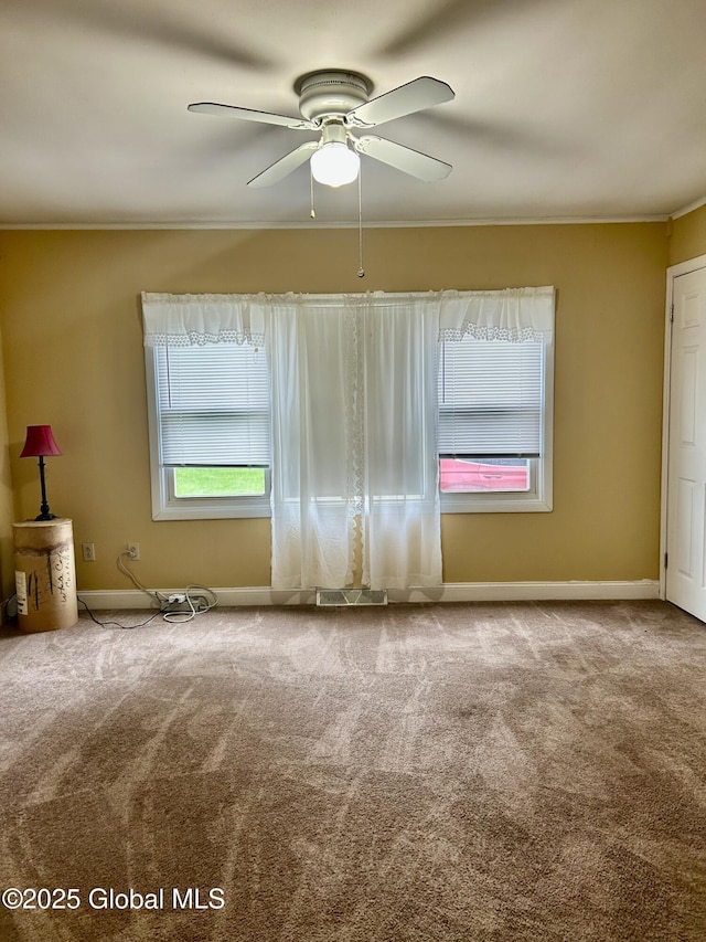 545 Gansevoort Rd, South Glens Falls, NY 12803 - empty room with carpet floors, ornamental molding, baseboards, and a ceiling fan