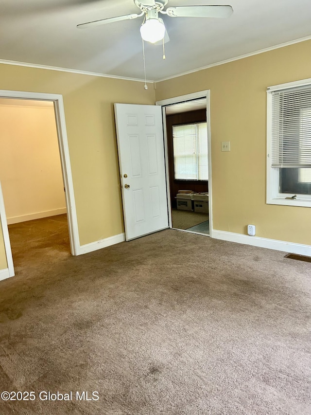 545 Gansevoort Rd, South Glens Falls, NY 12803 - carpeted empty room featuring crown molding, a ceiling fan, and baseboards