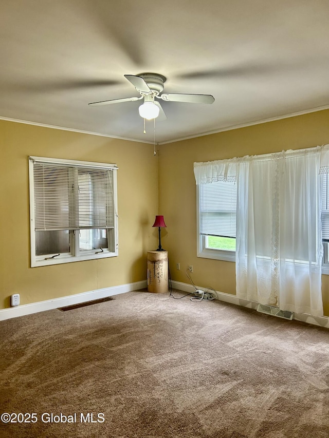 545 Gansevoort Rd, South Glens Falls, NY 12803 - carpeted spare room with crown molding, a ceiling fan, and baseboards