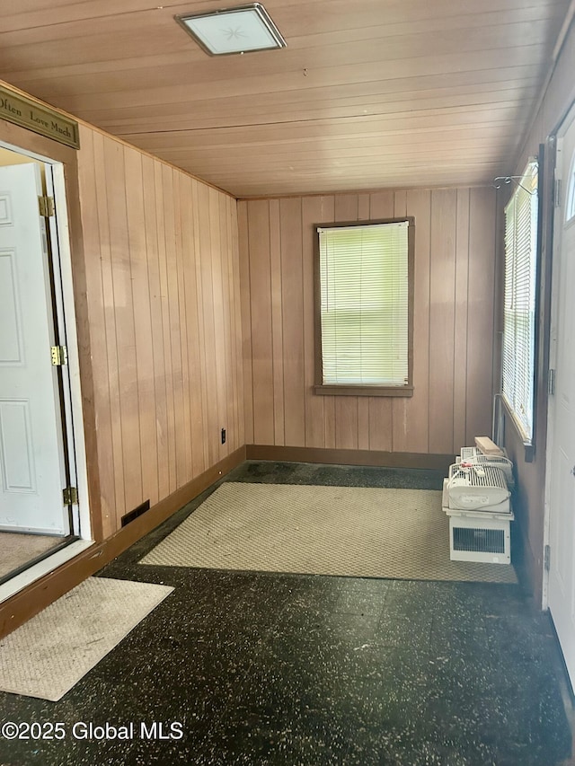 545 Gansevoort Rd, South Glens Falls, NY 12803 - spare room with wooden ceiling, baseboards, and wood walls