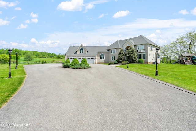 1310 Currybush Rd, Rotterdam, NY 12306 - view of front of house featuring a garage, driveway, and a front lawn