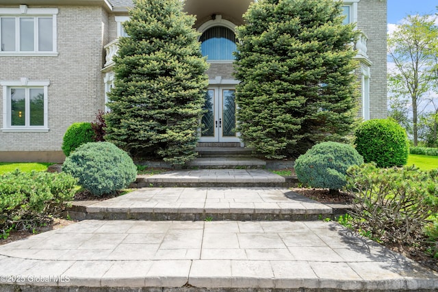 1310 Currybush Rd, Rotterdam, NY 12306 - view of exterior entry featuring french doors and brick siding
