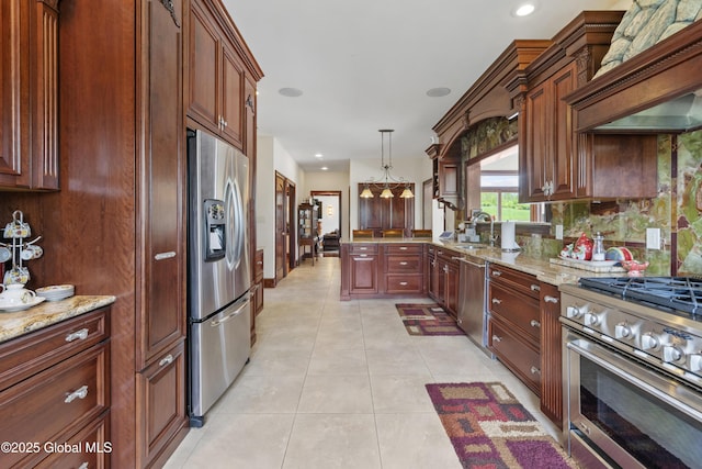 1310 Currybush Rd, Rotterdam, NY 12306 - kitchen with stainless steel appliances, a sink, hanging light fixtures, light stone countertops, and recessed lighting