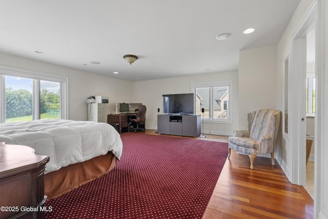 1310 Currybush Rd, Rotterdam, NY 12306 - bedroom with wood finished floors, multiple windows, an office area, recessed lighting, and baseboards