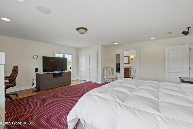 1310 Currybush Rd, Rotterdam, NY 12306 - bedroom with wood finished floors, baseboards, ensuite bath, recessed lighting, and a closet