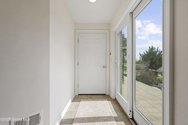 1310 Currybush Rd, Rotterdam, NY 12306 - doorway to outside with light stone finish flooring and baseboards