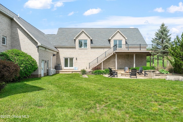 1310 Currybush Rd, Rotterdam, NY 12306 - back of property featuring a fire pit, a yard, a deck, and stairs