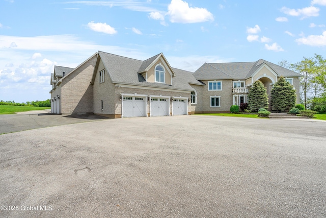 1310 Currybush Rd, Rotterdam, NY 12306 - view of front facade with asphalt driveway and a garage