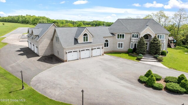 1310 Currybush Rd, Rotterdam, NY 12306 - view of front facade featuring asphalt driveway, a garage, a front yard, and a shingled roof