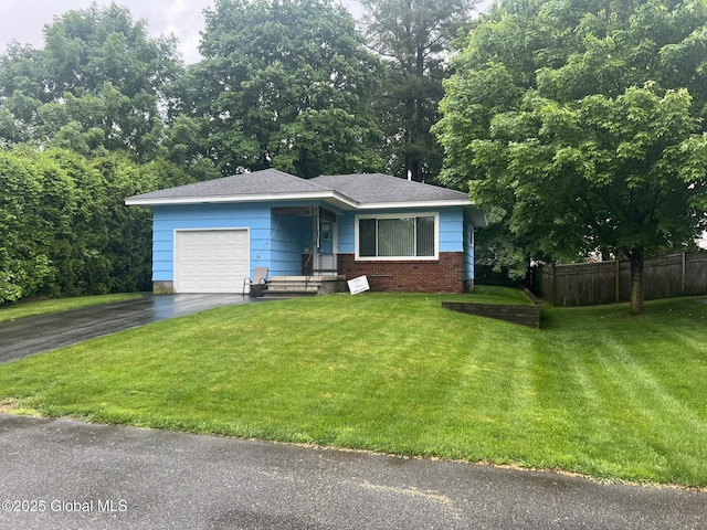 9 Potter St, Glens Falls, NY 12801 - view of front of house featuring an attached garage and asphalt driveway