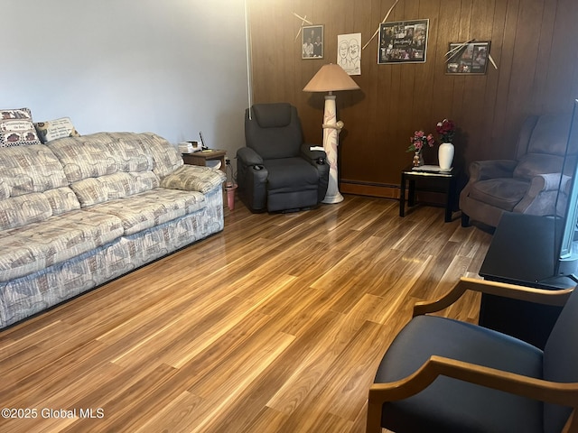 9 Potter St, Glens Falls, NY 12801 - living room with wood finished floors, baseboard heating, and wooden walls