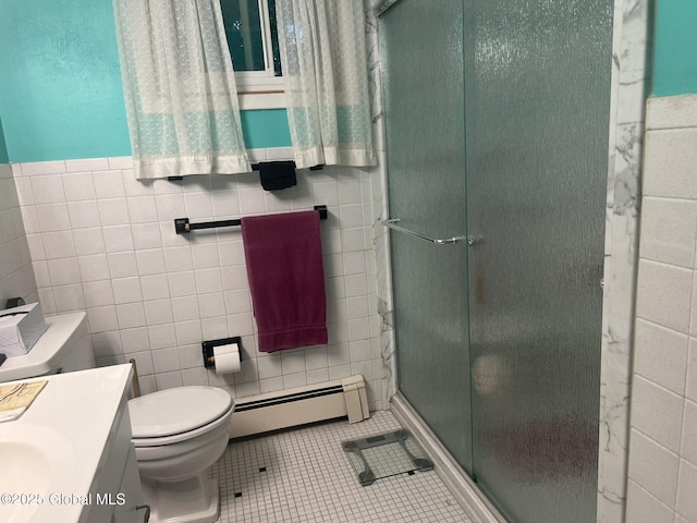 9 Potter St, Glens Falls, NY 12801 - bathroom featuring baseboard heating, toilet, vanity, a shower stall, and tile patterned flooring