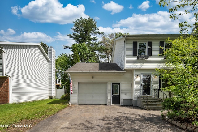 78 Dewitt Ave, Schenectady, NY 12304 - view of home's exterior featuring a garage and asphalt driveway