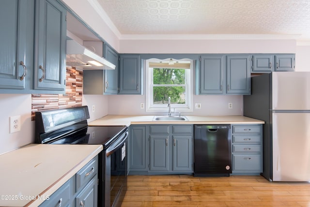 78 Dewitt Ave, Schenectady, NY 12304 - kitchen with black appliances, a sink, wall chimney range hood, light countertops, and ornamental molding