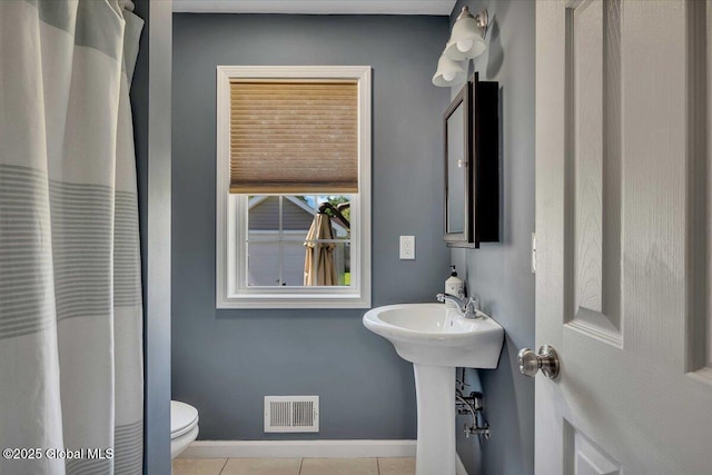 34 Wilson Ave, South Glens Falls, NY 12803 - bathroom with tile patterned floors and a shower with curtain