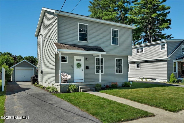 34 Wilson Ave, South Glens Falls, NY 12803 - view of front of property featuring an outdoor structure, a detached garage, driveway, and a front lawn