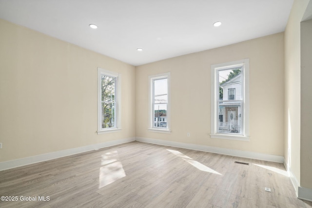 21 Kimball St, Amsterdam, NY 12010 - empty room with plenty of natural light, light wood finished floors, baseboards, and recessed lighting
