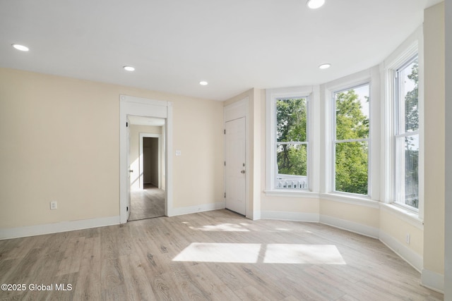 21 Kimball St, Amsterdam, NY 12010 - empty room featuring healthy amount of natural light, light wood finished floors, baseboards, and recessed lighting
