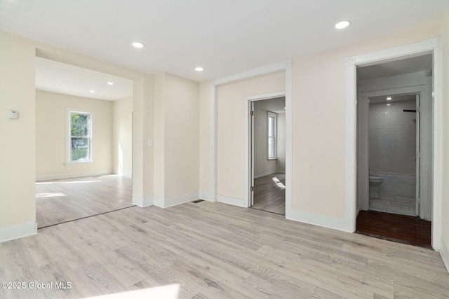 21 Kimball St, Amsterdam, NY 12010 - unfurnished bedroom featuring light wood-style floors, connected bathroom, baseboards, and recessed lighting