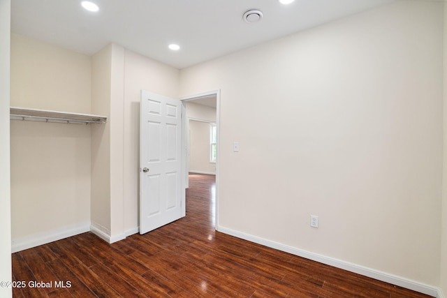 21 Kimball St, Amsterdam, NY 12010 - unfurnished bedroom with dark wood-type flooring, baseboards, a closet, and recessed lighting