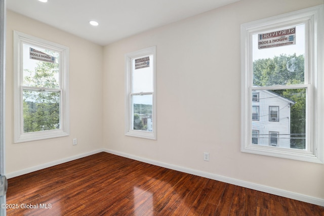 21 Kimball St, Amsterdam, NY 12010 - spare room featuring baseboards, dark wood-type flooring, and recessed lighting