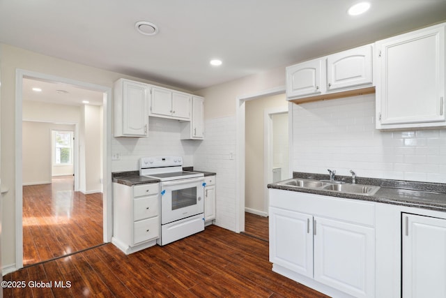 21 Kimball St, Amsterdam, NY 12010 - kitchen with electric range, dark countertops, a sink, white cabinetry, and dark wood-type flooring