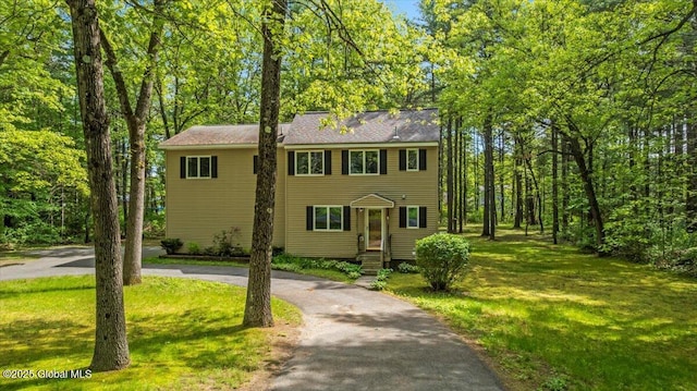 140 Redmond Rd, Moreau, NY 12831 - colonial-style house with curved driveway and a front lawn