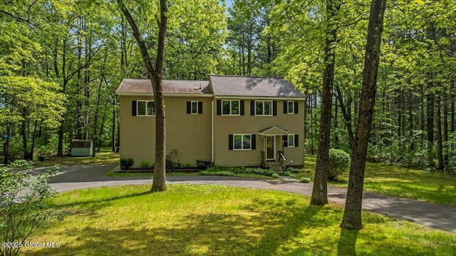 140 Redmond Rd, Moreau, NY 12831 - view of front of property featuring asphalt driveway, a front lawn, and an outbuilding