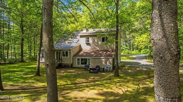 140 Redmond Rd, Moreau, NY 12831 - back of house with a chimney and a yard