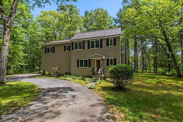 140 Redmond Rd, Moreau, NY 12831 - colonial-style house with driveway and a front yard