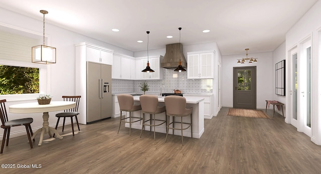 5 Seville Way, Bethlehem, NY 12158 - kitchen featuring premium range hood, built in fridge, light countertops, tasteful backsplash, and dark wood finished floors