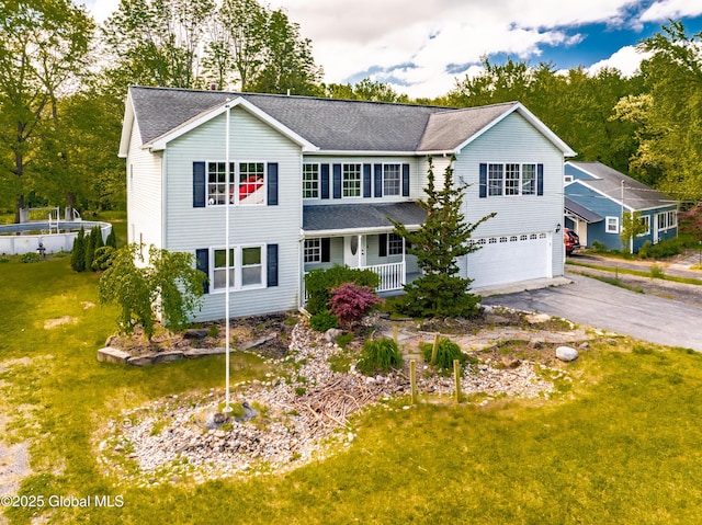 7116 Fuller Station Rd, Schenectady, NY 12303 - traditional home featuring covered porch, a garage, asphalt driveway, a shingled roof, and a front lawn