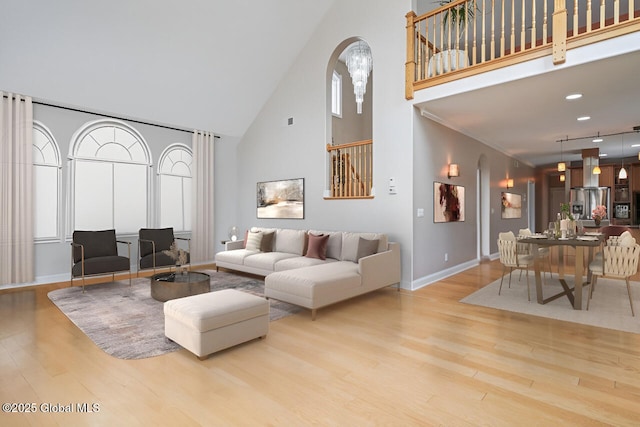 2085 Weast Rd, Princetown, NY 12137 - living room with a high ceiling, wood finished floors, baseboards, and arched walkways