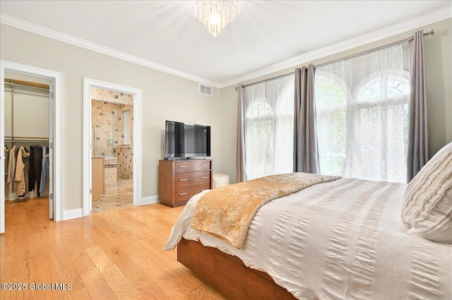 2085 Weast Rd, Princetown, NY 12137 - bedroom featuring light wood-style flooring, ornamental molding, a closet, a walk in closet, and baseboards
