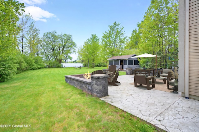 2085 Weast Rd, Princetown, NY 12137 - view of green lawn featuring an outdoor fire pit and a patio