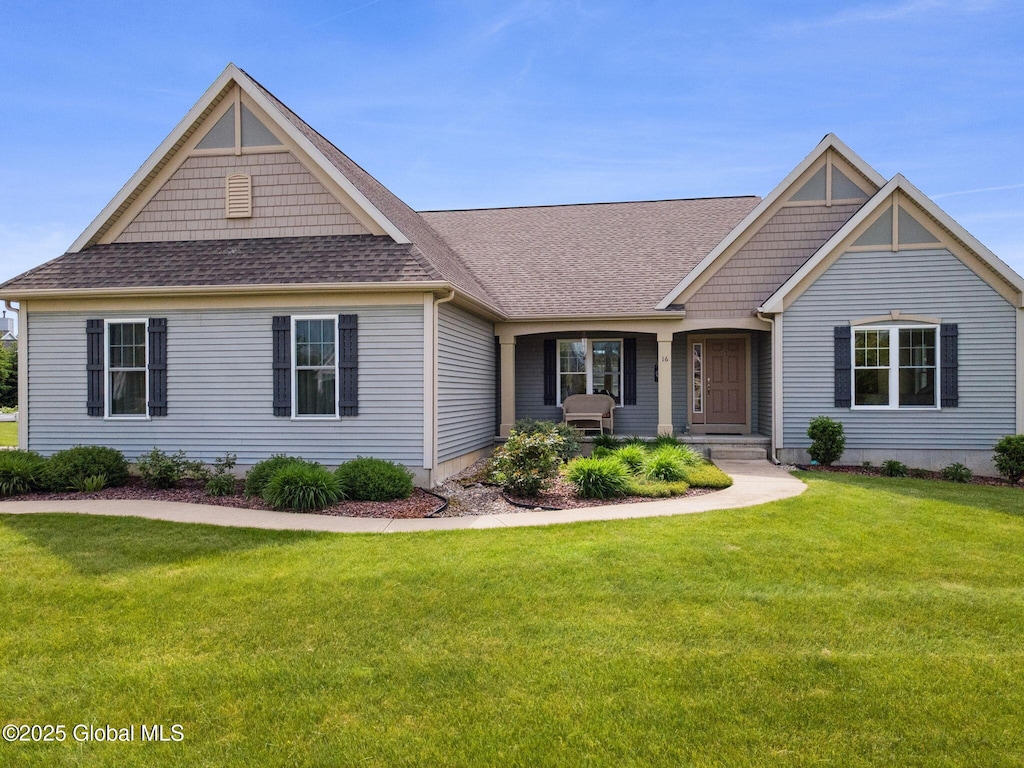 16 Saville Row, Mechanicville, NY 12118 - view of front facade featuring roof with shingles and a front lawn