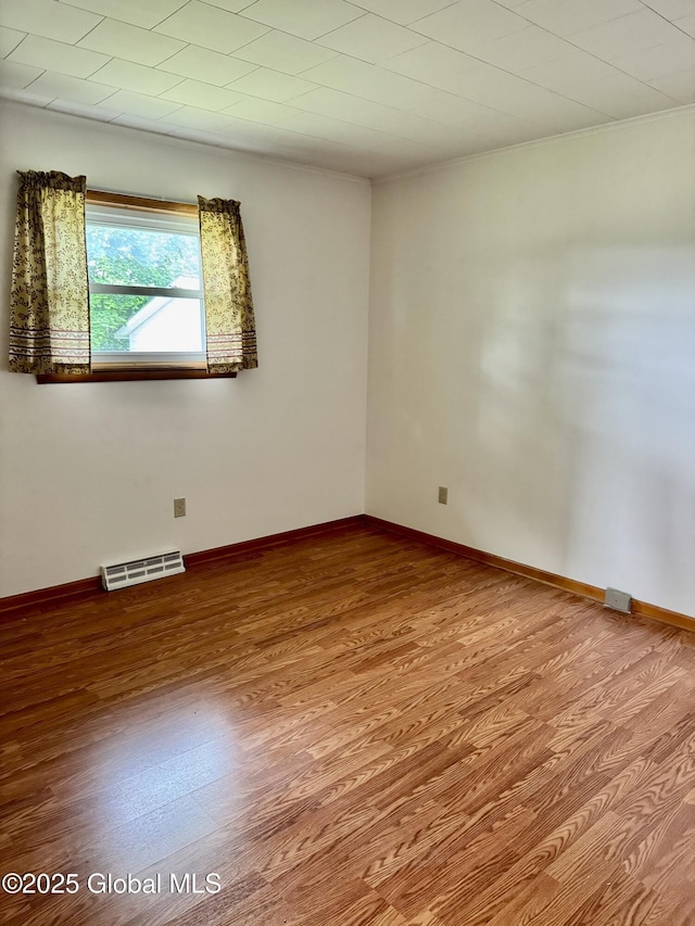 210 County Route 44, Argyle, NY 12809 - empty room with wood finished floors, crown molding, and baseboards