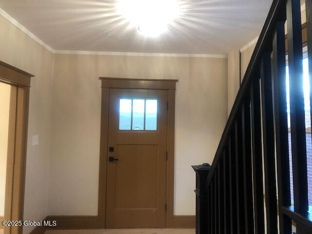 50 Mapleridge Ave, Albany, NY 12209 - entryway featuring stairs and crown molding