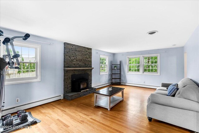 19 Barney Rd, Clifton Park, NY 12065 - living room featuring baseboard heating and wood finished floors