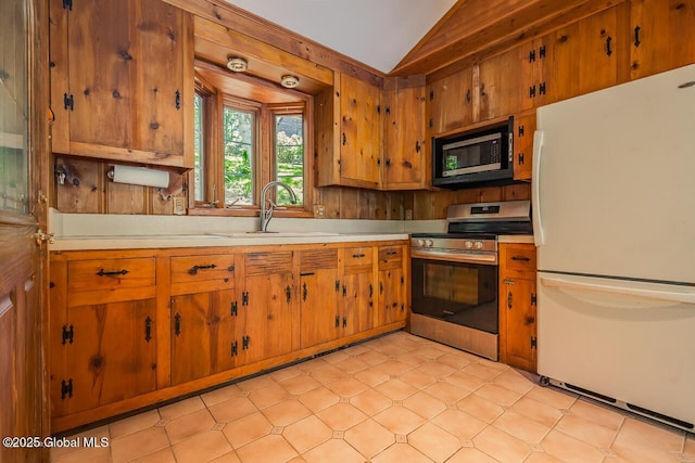 241 Kunkel Rd, Mayfield, NY 12117 - kitchen with appliances with stainless steel finishes, a sink, light countertops, lofted ceiling, and brown cabinetry