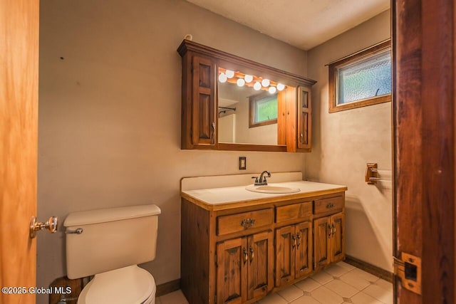 241 Kunkel Rd, Mayfield, NY 12117 - bathroom featuring toilet, vanity, tile patterned floors, and baseboards