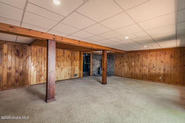 241 Kunkel Rd, Mayfield, NY 12117 - finished below grade area with carpet, wooden walls, a drop ceiling, and baseboards