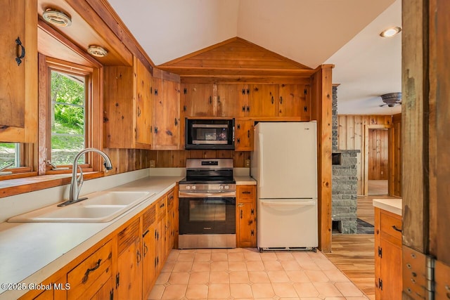 241 Kunkel Rd, Mayfield, NY 12117 - kitchen with freestanding refrigerator, black microwave, stainless steel electric range, a sink, and lofted ceiling