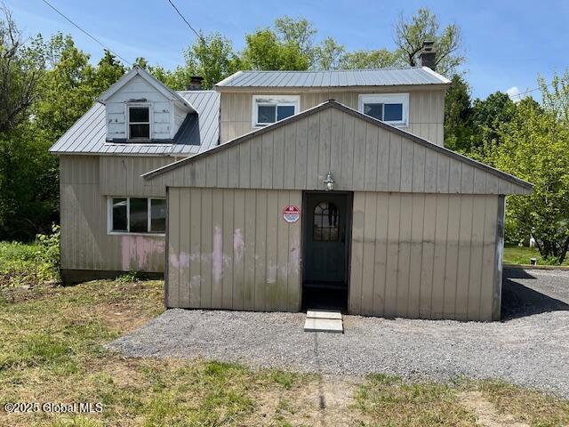 854 Millers Corners Rd, Florida, NY 12053 - view of front of home featuring metal roof, a chimney, and an outbuilding