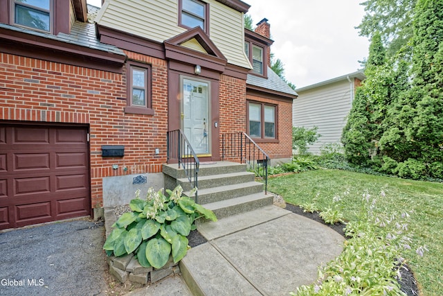 5 Kakely St, Albany, NY 12208 - doorway to property with brick siding, a chimney, and a yard