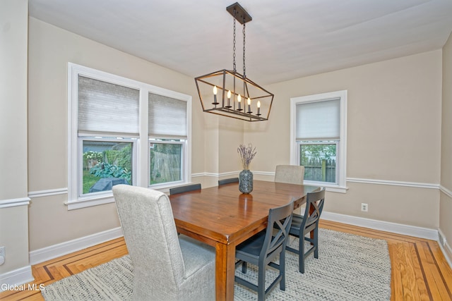 5 Kakely St, Albany, NY 12208 - dining area featuring a chandelier and wood finished floors