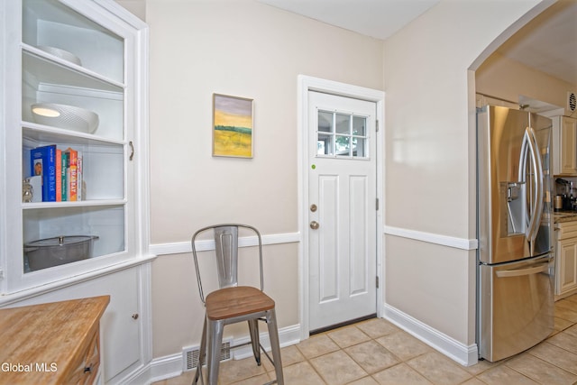 5 Kakely St, Albany, NY 12208 - foyer entrance with arched walkways and light tile patterned flooring