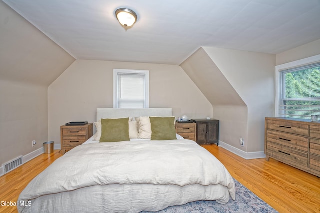 5 Kakely St, Albany, NY 12208 - bedroom featuring multiple windows, light wood finished floors, and vaulted ceiling