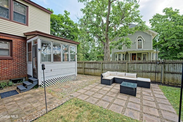 5 Kakely St, Albany, NY 12208 - fenced backyard with outdoor lounge area, a patio, and entry steps